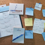 Cork board with post it notes labeling Corkboard Concept's services